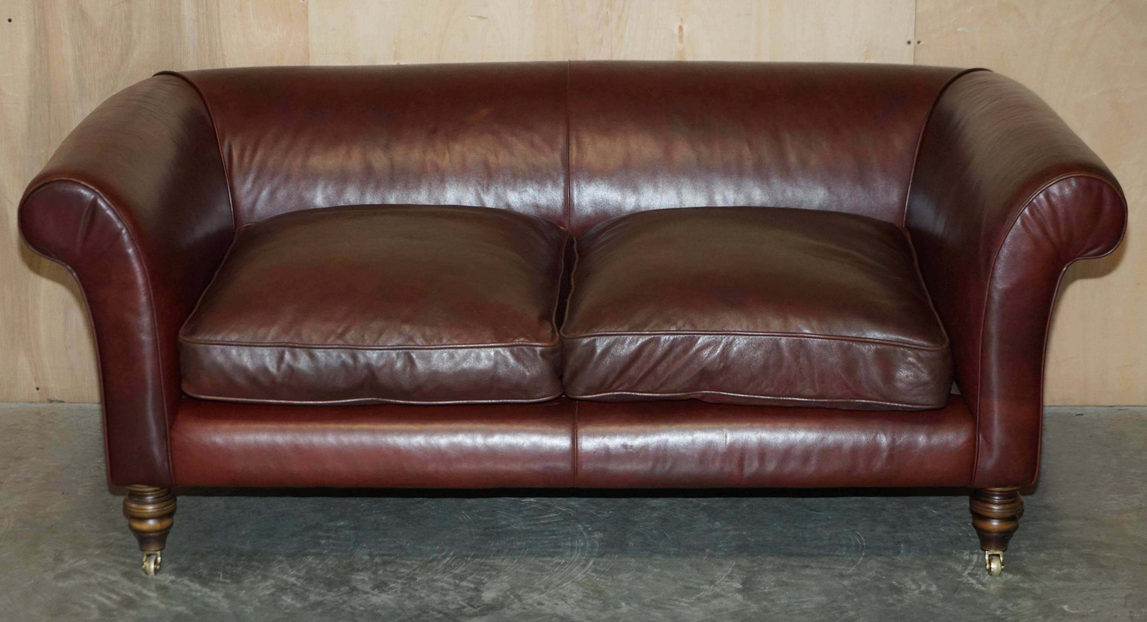 Vintage Art Deco leather sofa, three-seater, feather cushions.