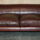 Vintage Art Deco leather sofa, three-seater, feather cushions.