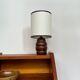 Turned wooden bedside lamp.