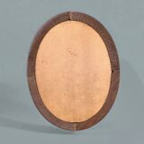 Old large oval wooden wall mirror