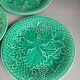 Three green slip plates