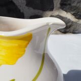 Pitcher with yellow flowers