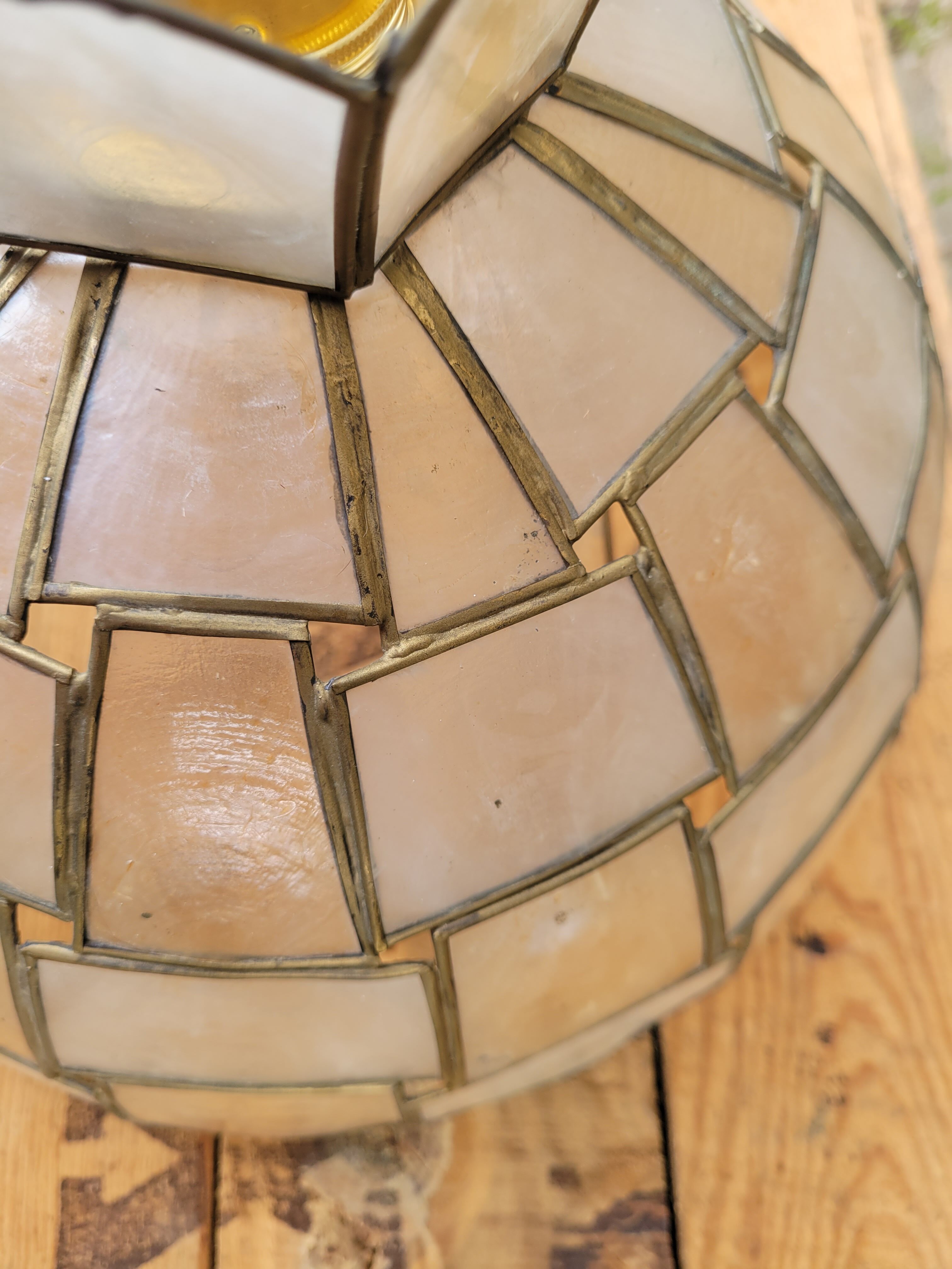 Suspension in mother-of-pearl and brass