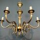 Bronze chandelier with ram's head motifs in the Louis XVI style, in the manner of Maison Jansen.