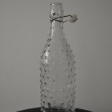 Clear bottle with pegs