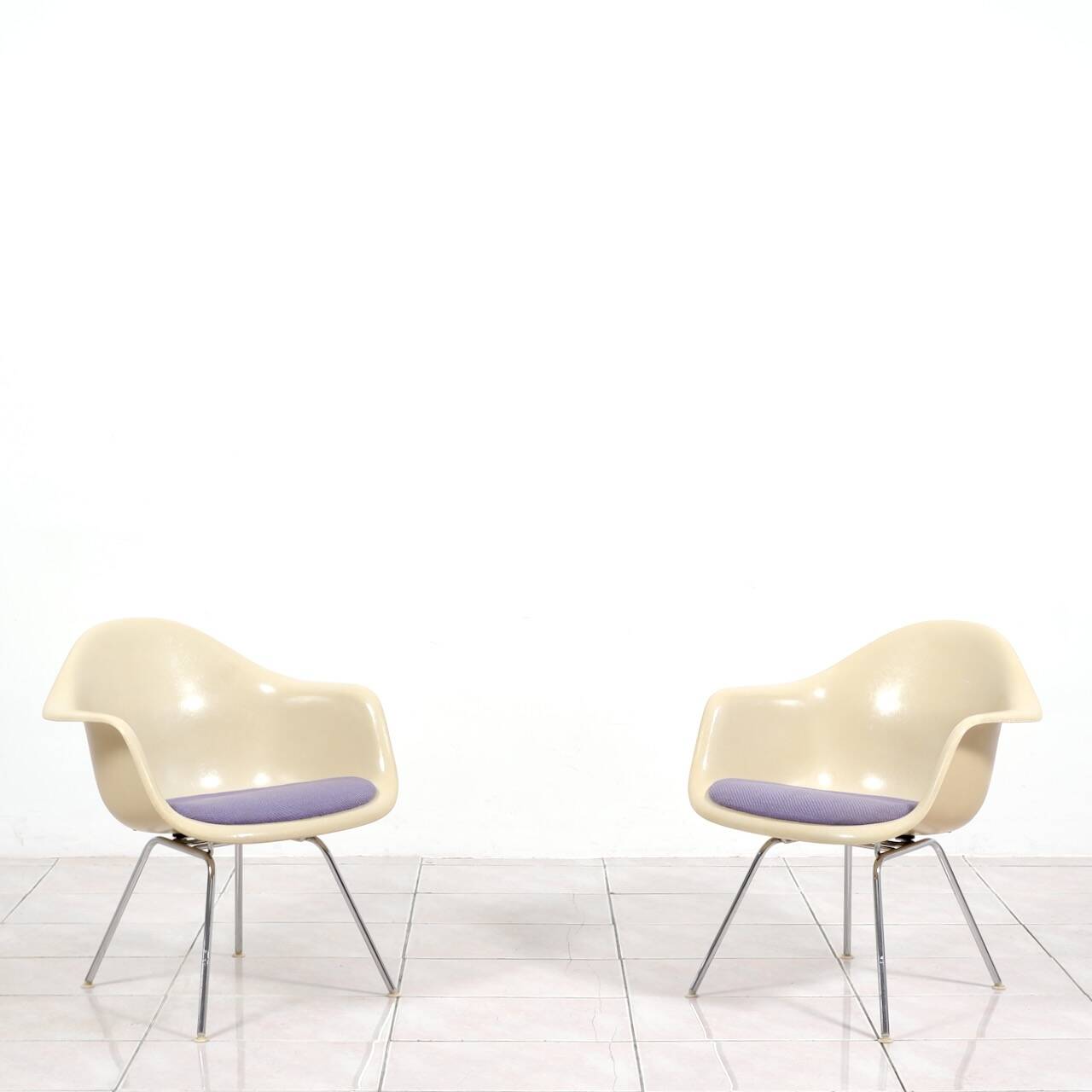4 Eames DAX fiberglass lounge chairs with purple upholstery by Herman Mille