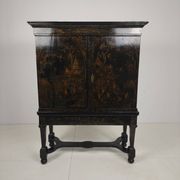 A rare early 18th-century Dutch japanned chinoiserie cabinet, circa 1700