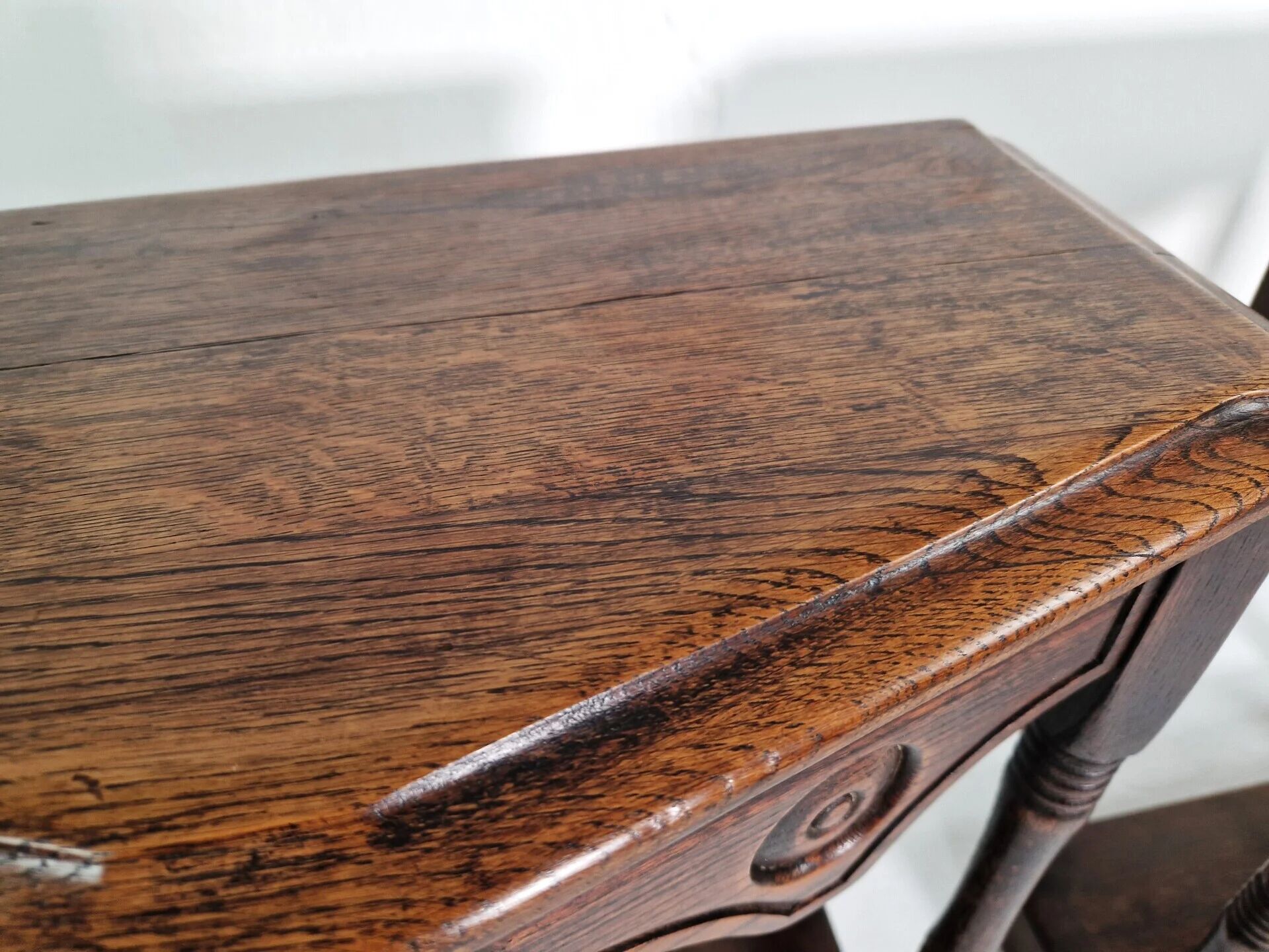 Pair of English 1920s carved oak sidetables