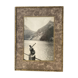 Old black and white film photograph of a couple in the mountains