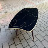 Coffee table in black glass and wood