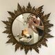 Sun mirror decorated with golden leaves, circa 1950.