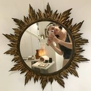 Sun mirror decorated with golden leaves, circa 1950.