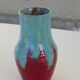 An emailed ceramic vase in turquoise and red, design and vintage
