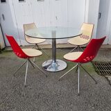 Guzzini dining set, round glass table and 4 shell chairs.