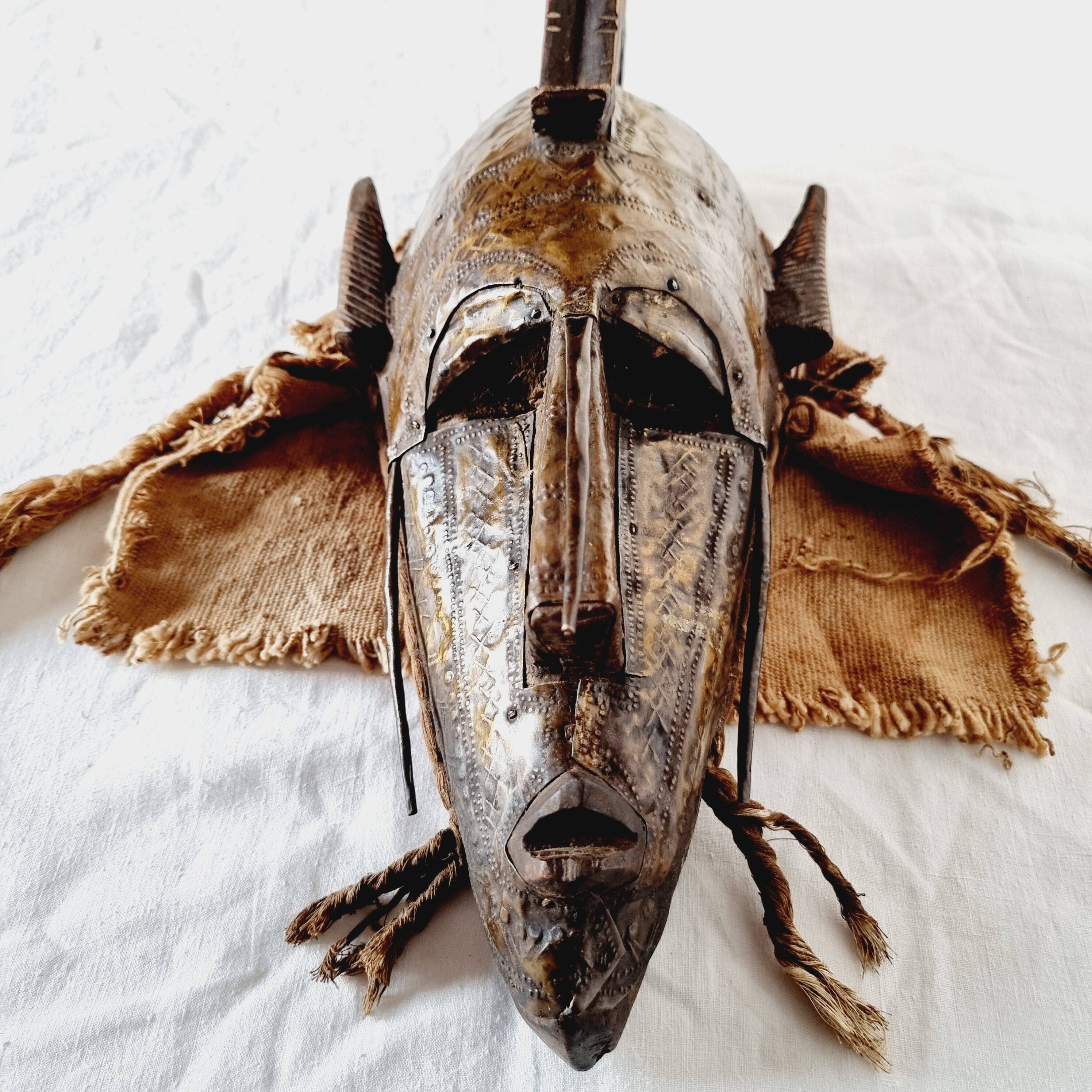 African mask from Mali from the N'Tomo tribe of Marka covered in chiseled brass