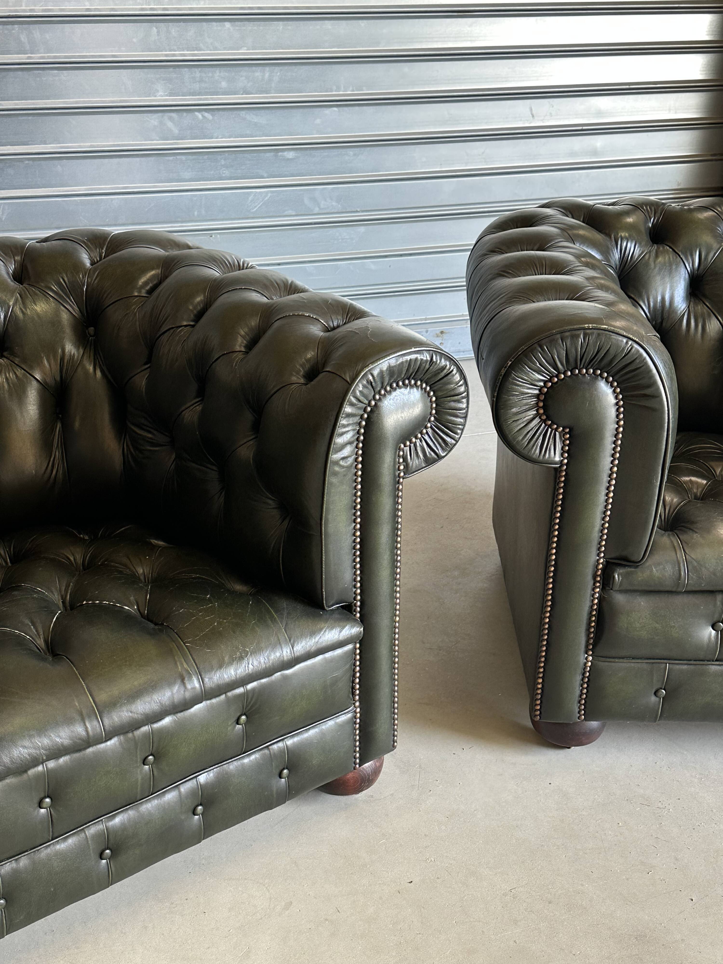 Title: Pair of vintage olive green leather Chesterfield armchairs