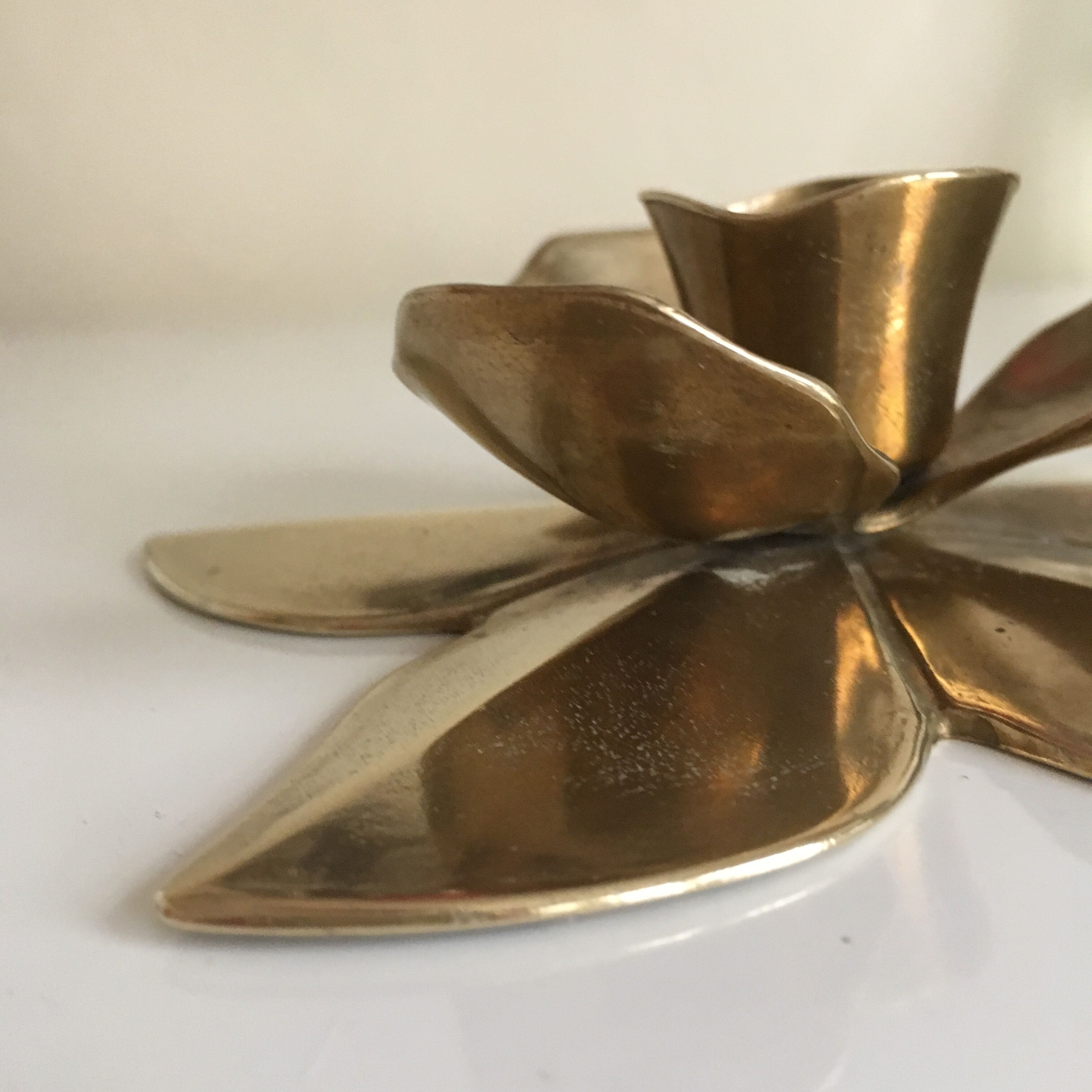 Flower-shaped brass candleholder