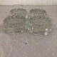 4 flat glass candle holders cut in the shape of Vintage flowers