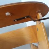 Baumann Baby Coquille children's armchair in bent wood with splayed legs.