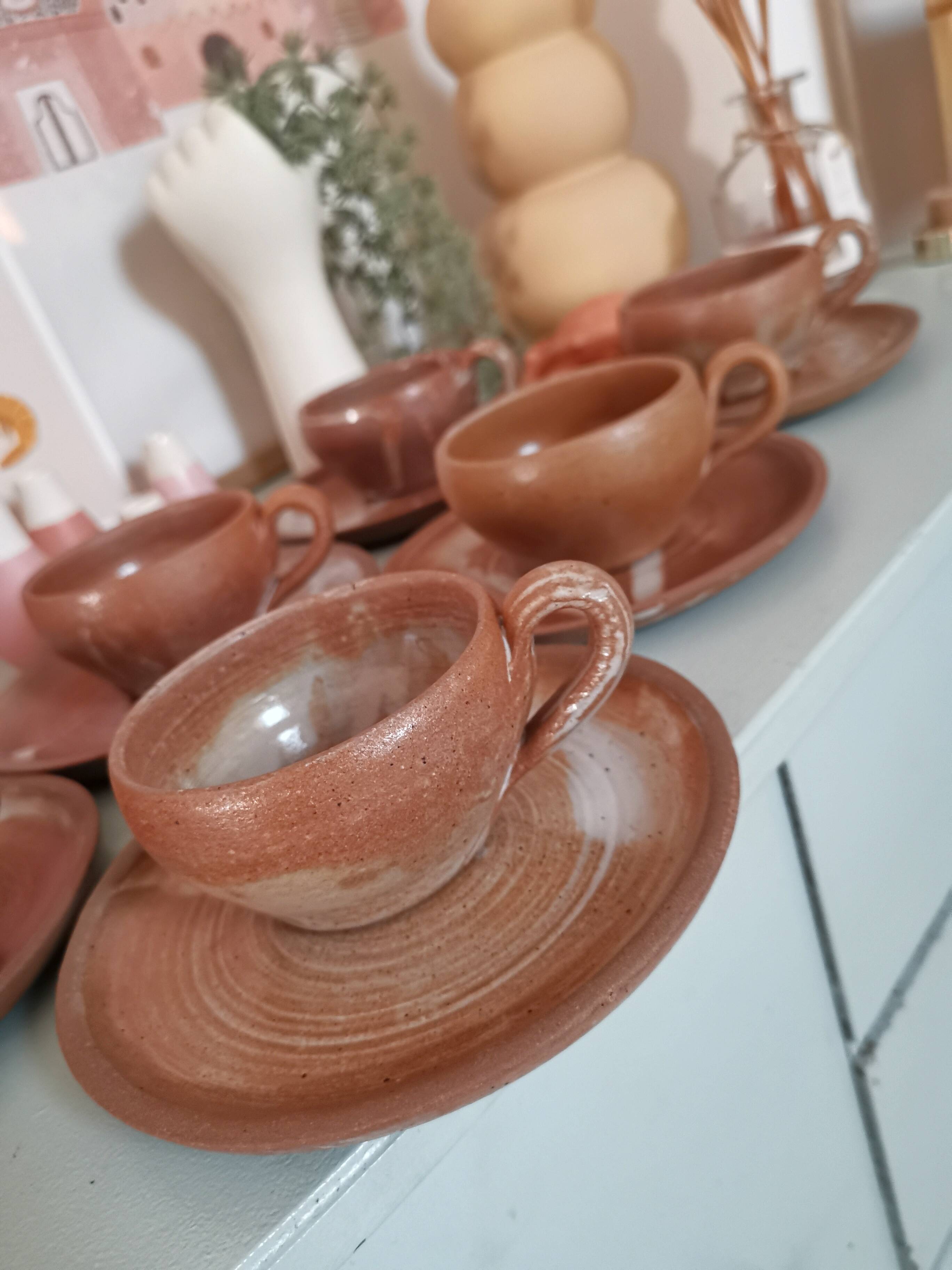 Set of vintage stoneware cups and saucers