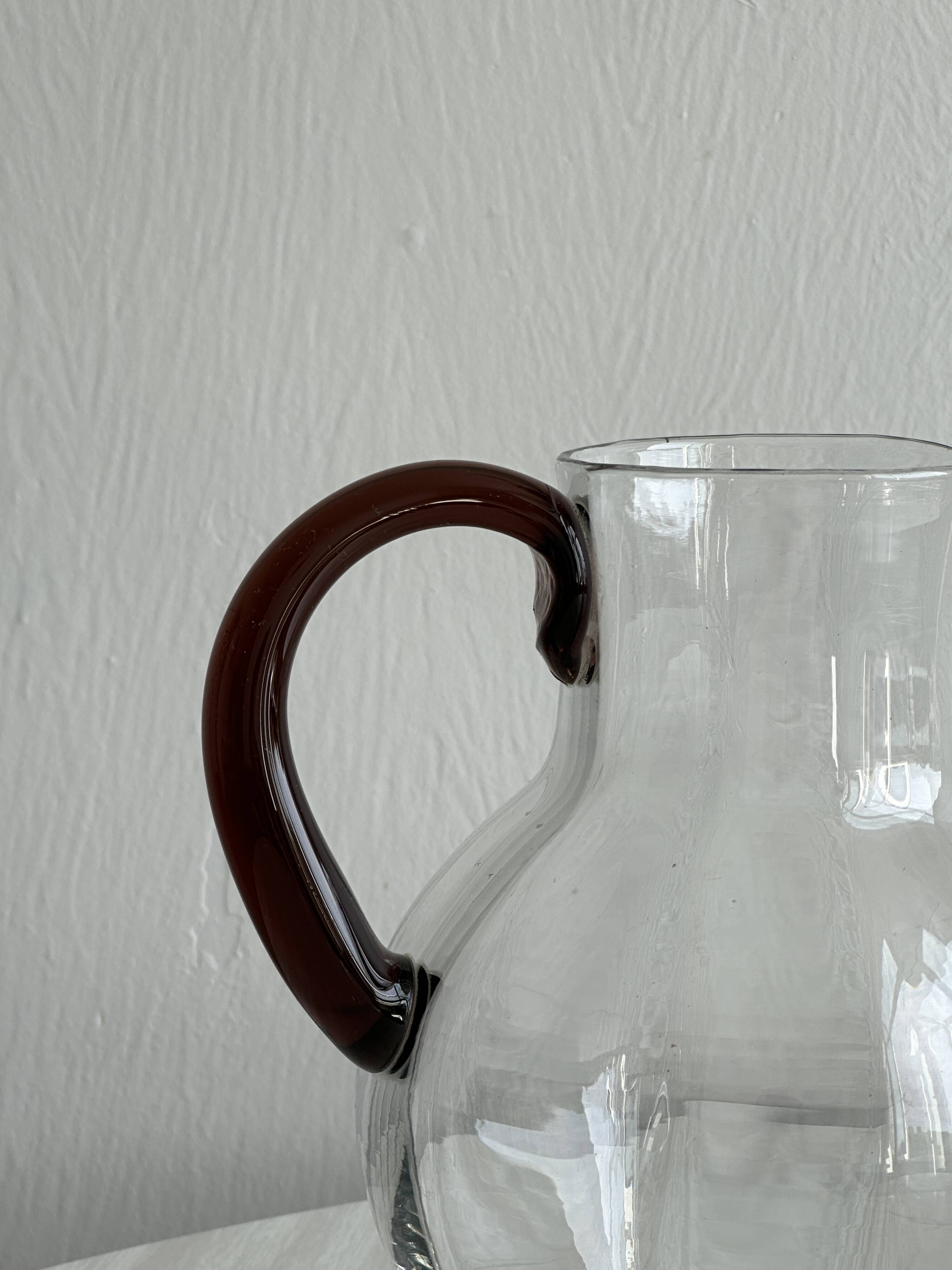 Vintage blown glass pitcher with brown handle