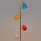 Tubular pendant light in patinated and lacquered brass. Contemporary