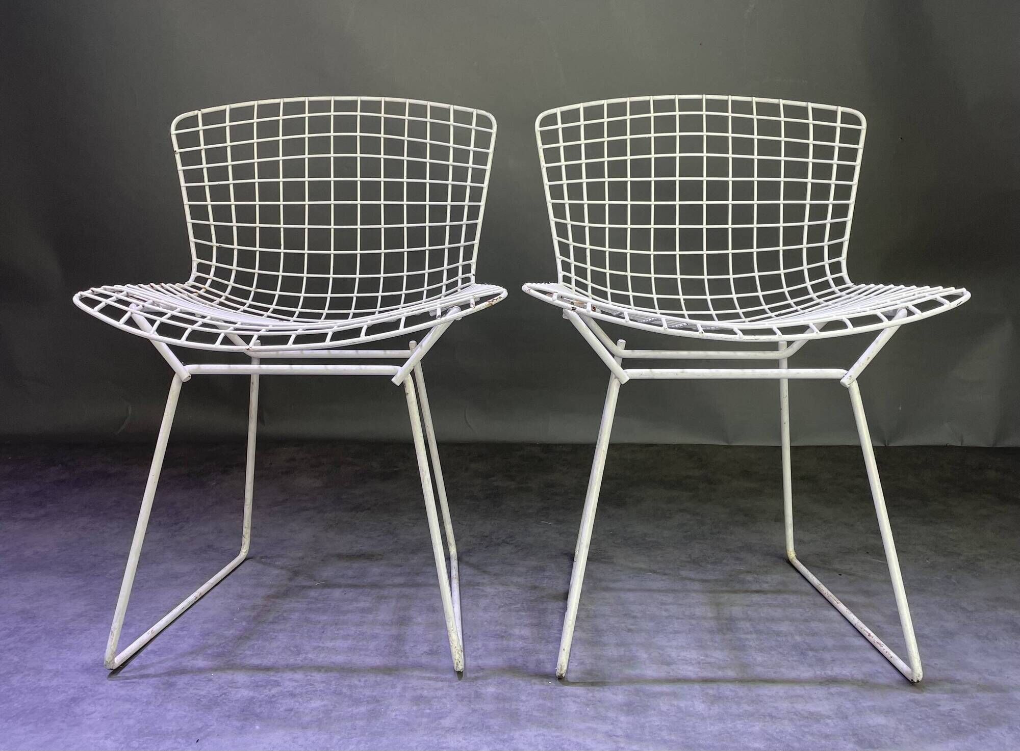 Pair of white lacquered Bertoia chairs