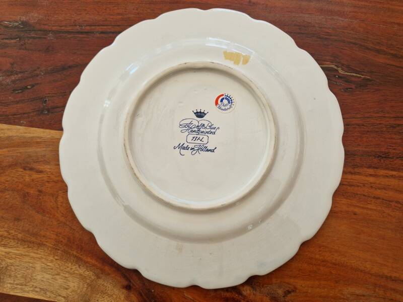 Delft Blue earthenware plate with a mill by a river decoration