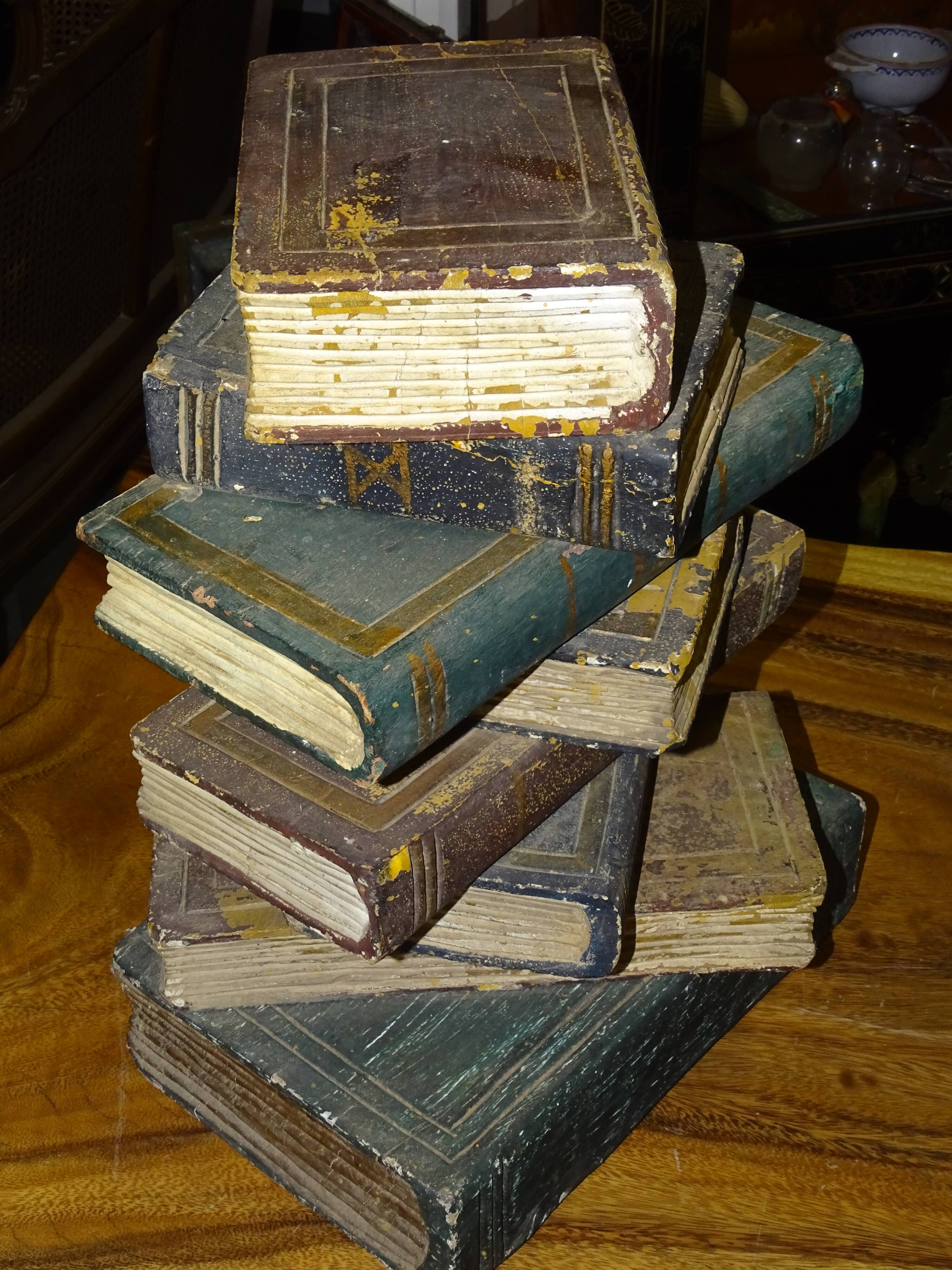side table, end of sofa stack of wooden books, old, beautiful patina