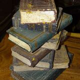 side table, end of sofa stack of wooden books, old, beautiful patina