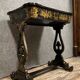 Lacquered work table, blackened wood decorated with Chinese scenes, Napoleon III period circa 1850
