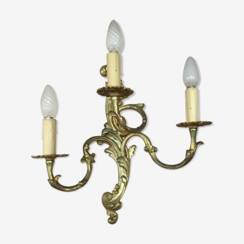 Louis XV-style wall light in solid bronze