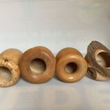 Four solid turned wooden vases