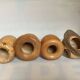 Four solid turned wooden vases