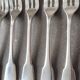 Set of 12 dessert forks and a cake server.