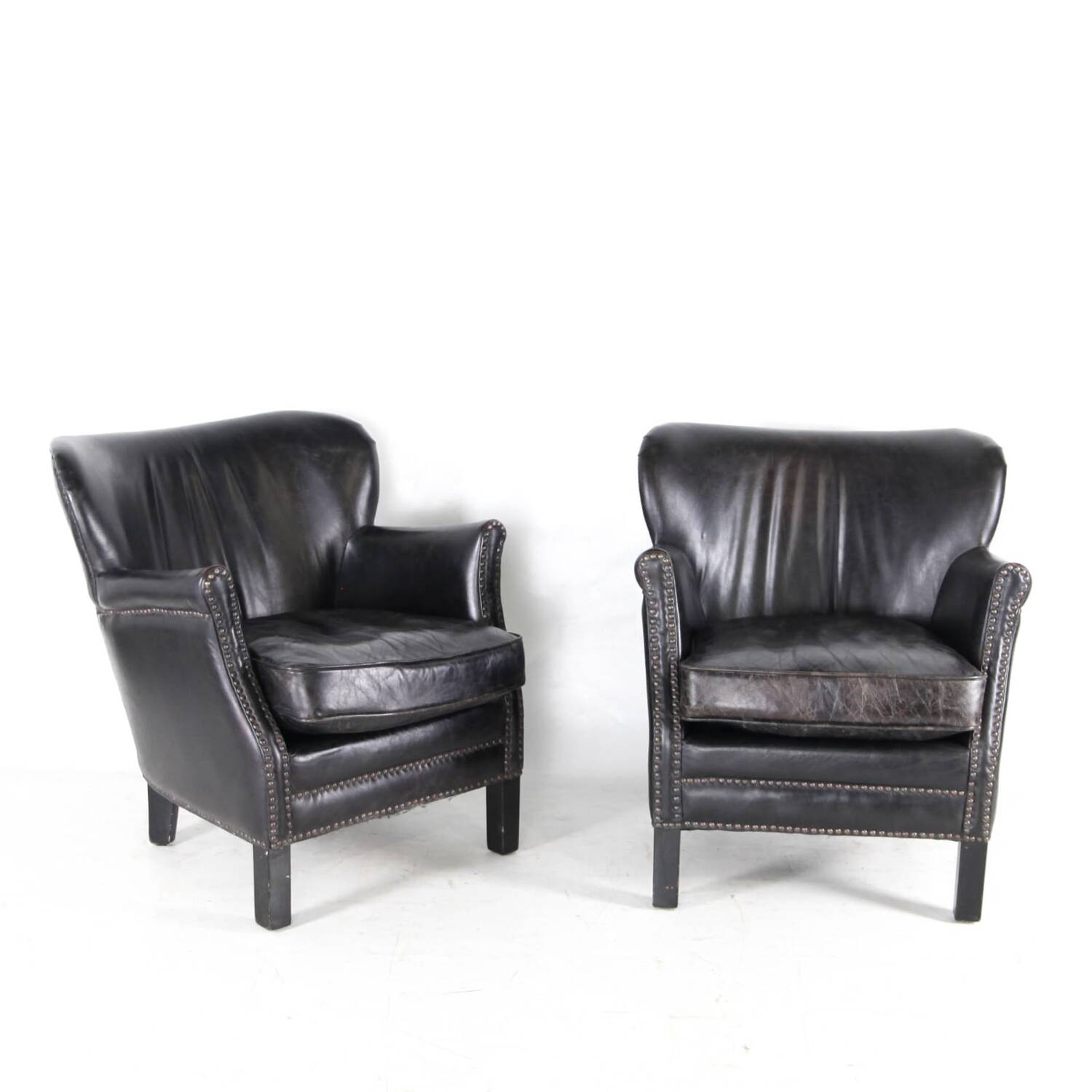 Pair of small leather club armchairs