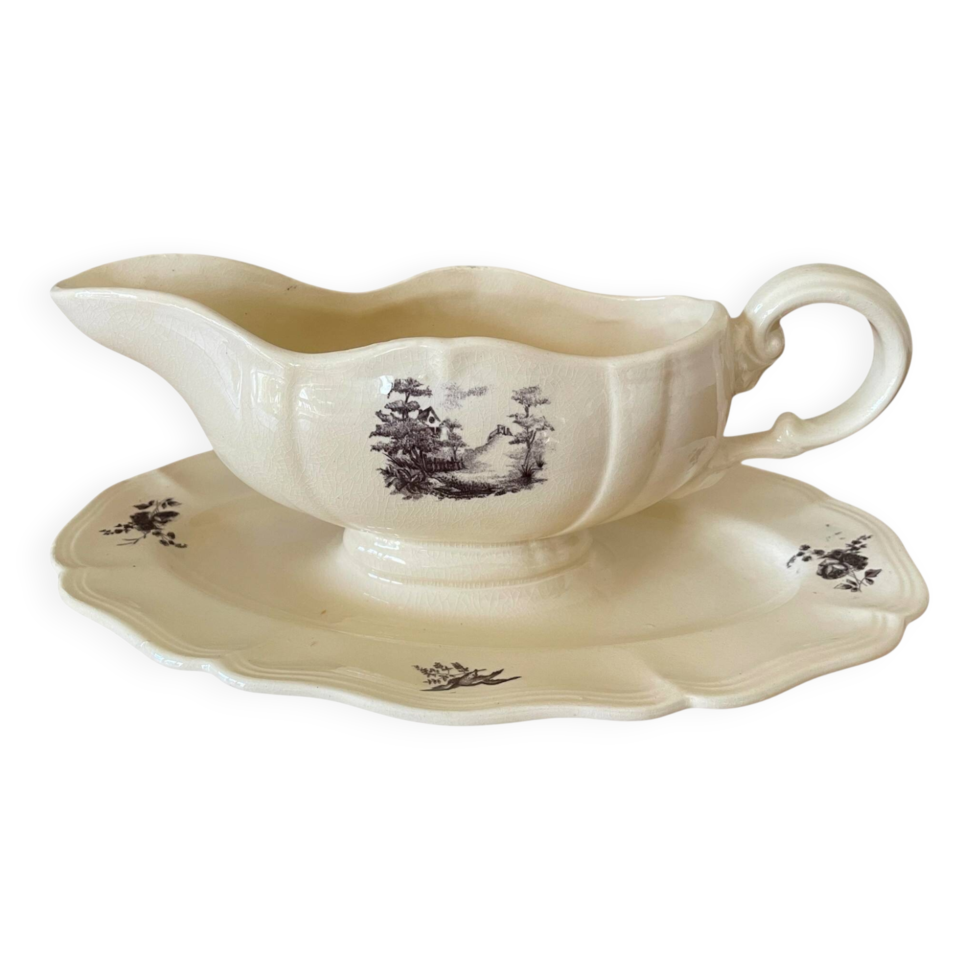 Antique sauce boat in Sarreguemines earthenware.