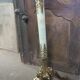 Coat holder on onyx and gold metal foot