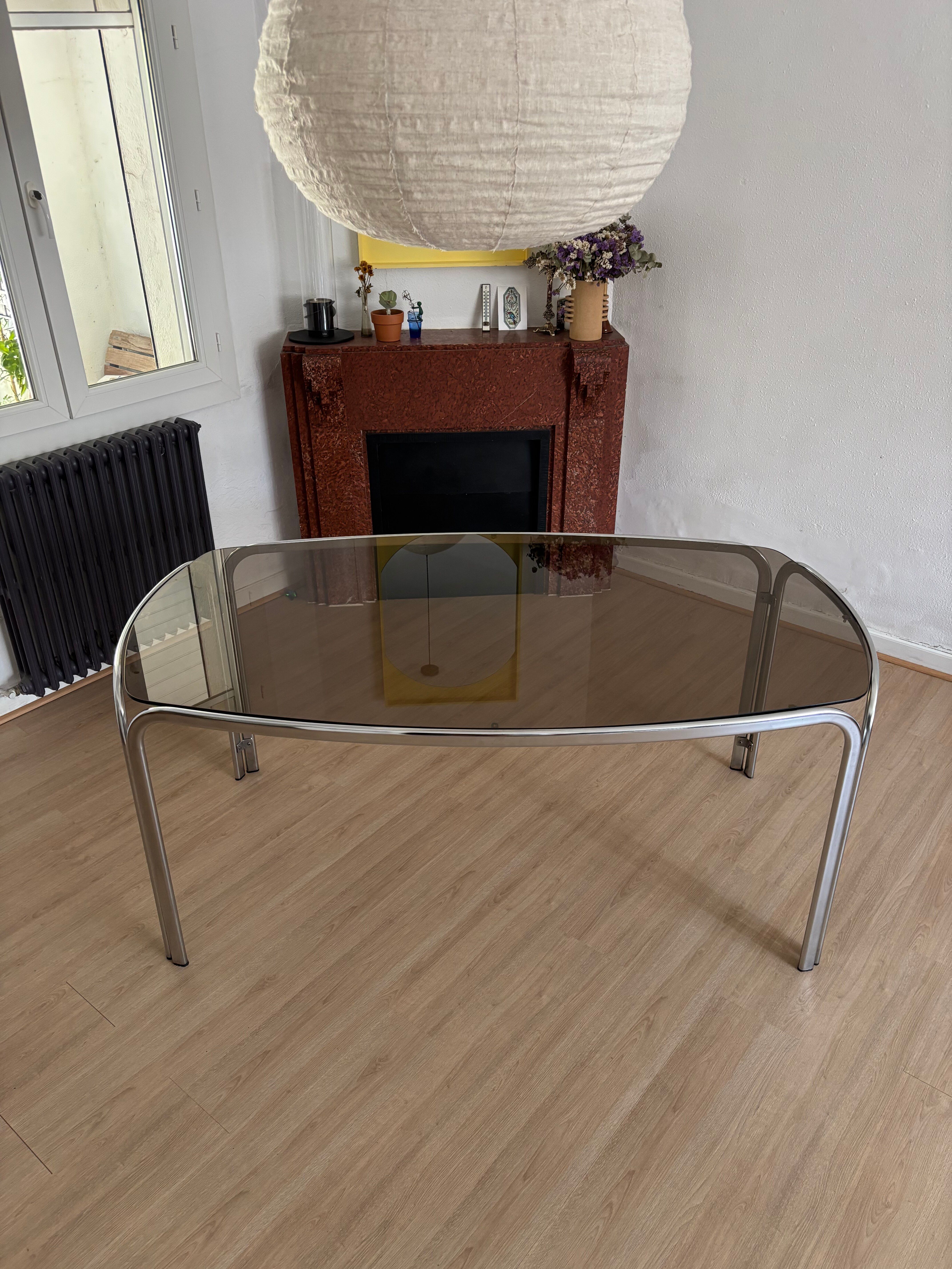Smoked glass dining table from the 1970s.