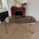 Smoked glass dining table from the 1970s.