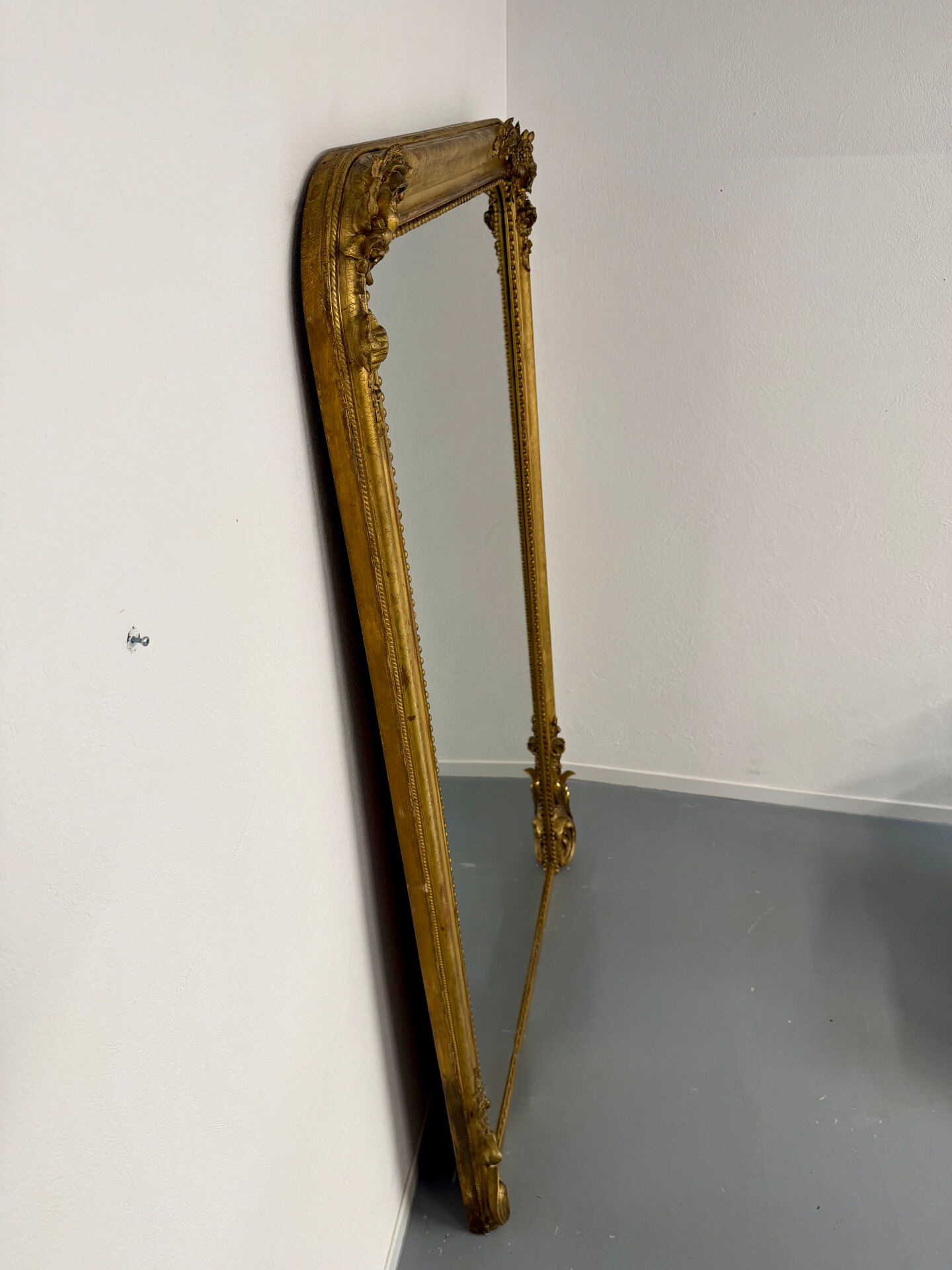 Large Napoleon III mirror with wooden gilded frame, 19th century, 200 cm.