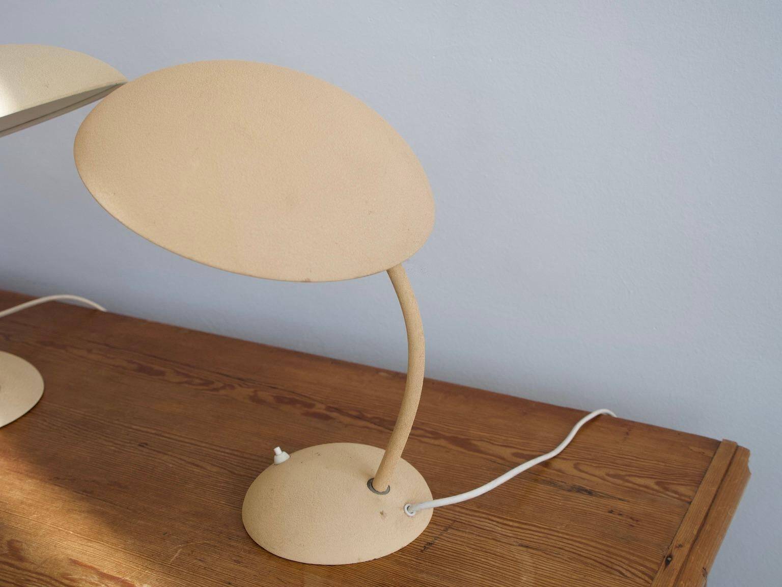 Pair of painted beige metal table lamps, 1930s