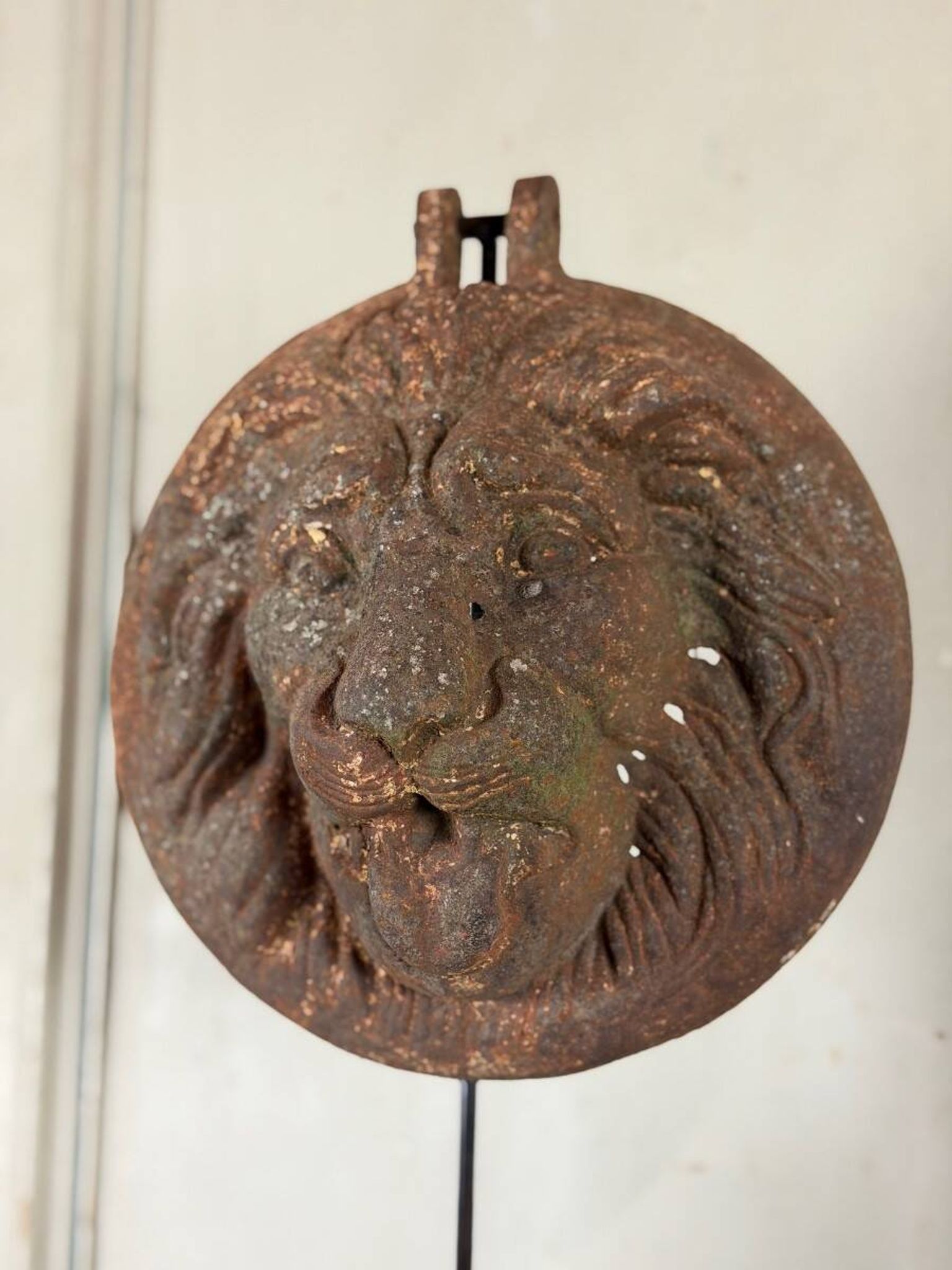 Three cast-iron and terracotta façade decoration lions, around 1880.