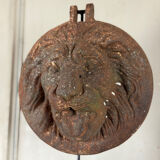 Three cast-iron and terracotta façade decoration lions, around 1880.