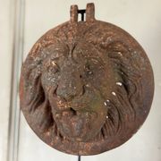Three cast-iron and terracotta façade decoration lions, around 1880.