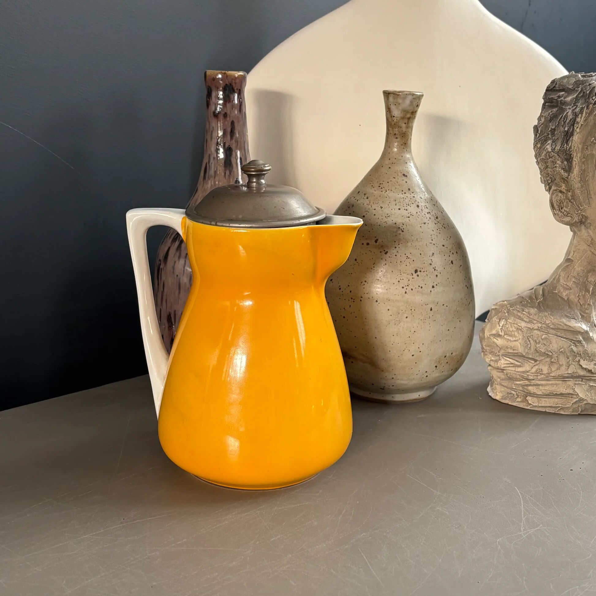 Antique teapot in earthenware with a tin filter lid.