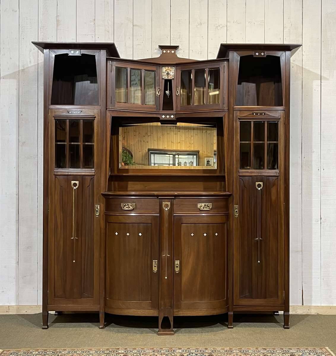 Art Nouveau mahogany buffet with clock in the style of G. Serrurier Bovy.