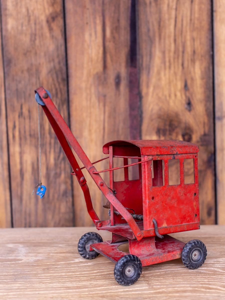 Old toy truck crane in sheet metal