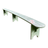 Old curved wooden farm bench