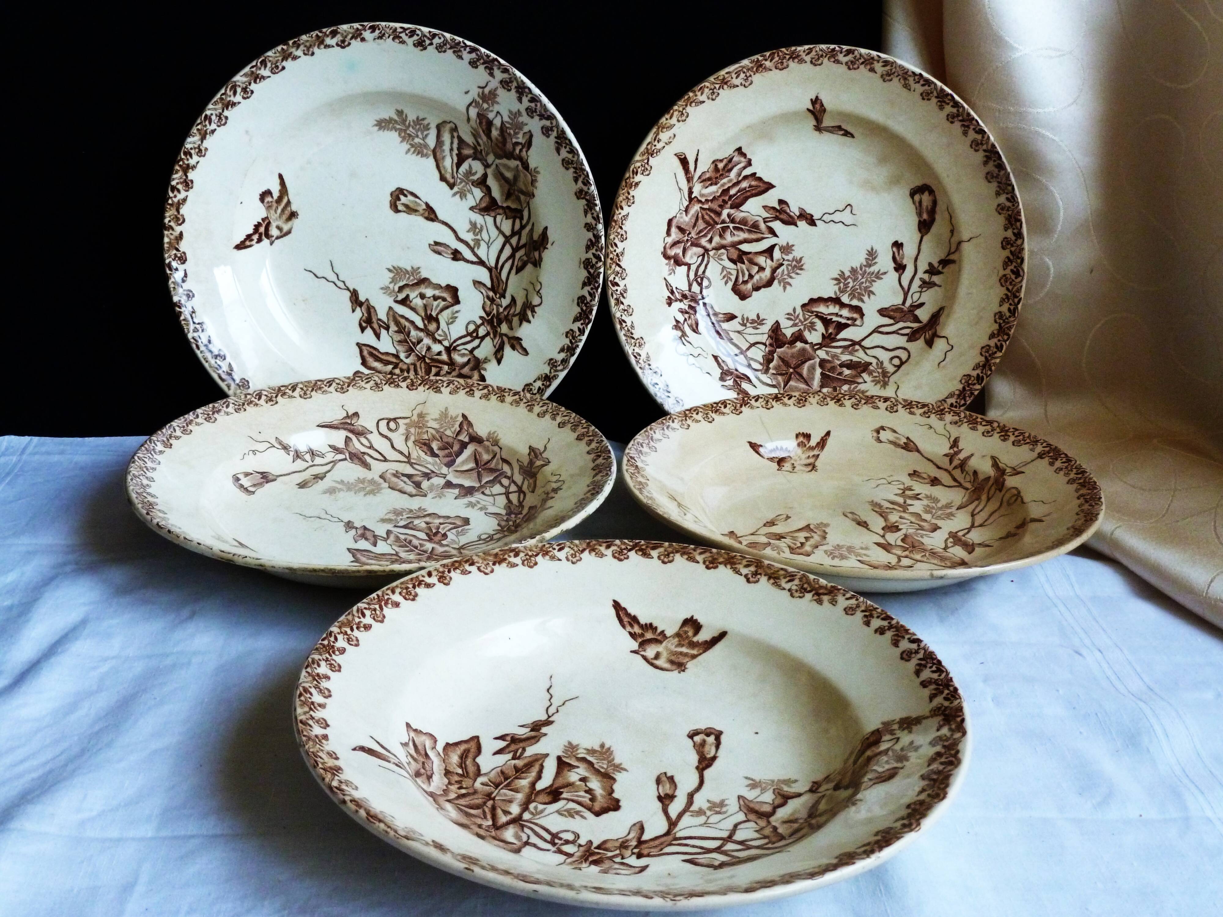 Antique deep plates from the late 19th century, old French crockery.